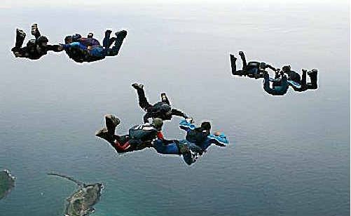 Skydivers take to the skies. Skydivers take to the skies.